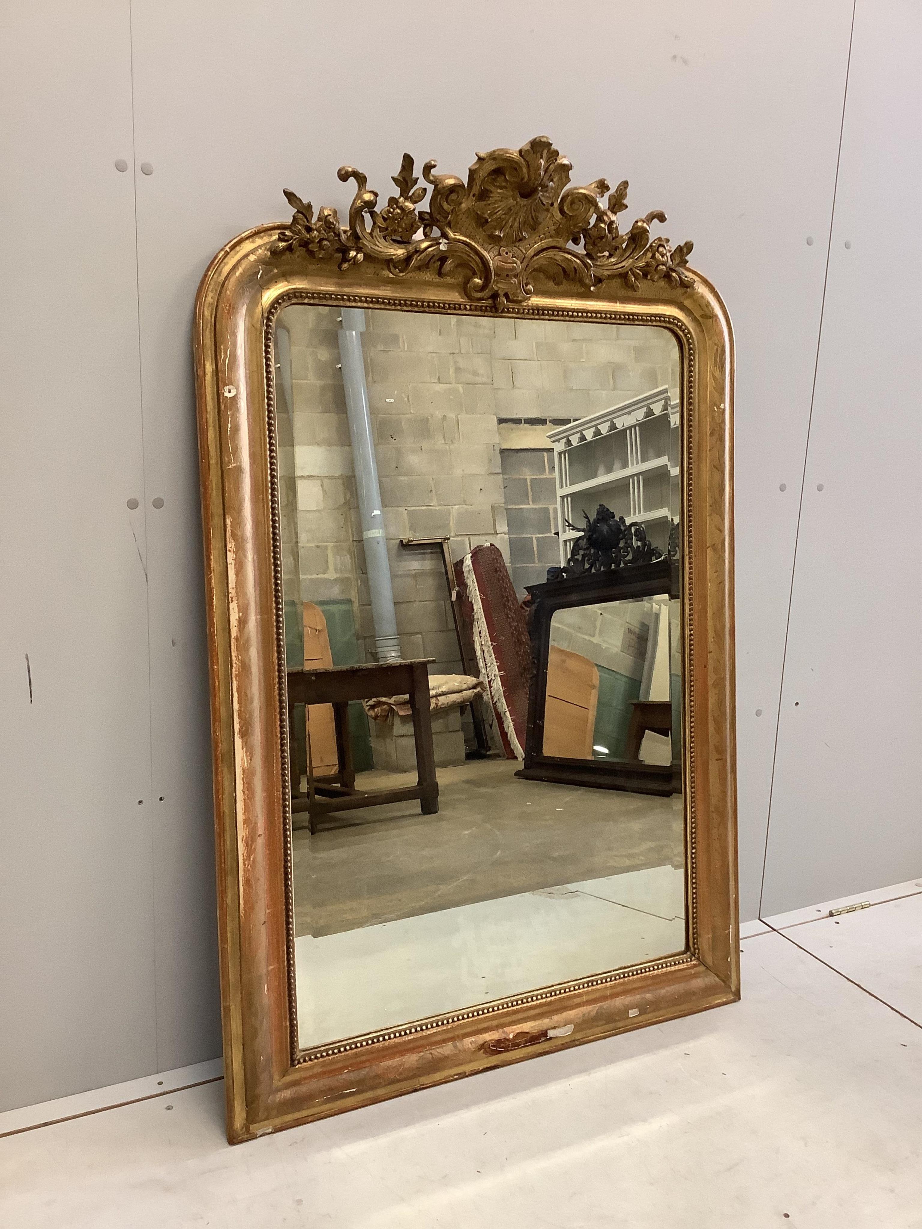 A 19th century French giltwood and composition overmantel mirror, width 92cm, height 140cm. Condition - fair
